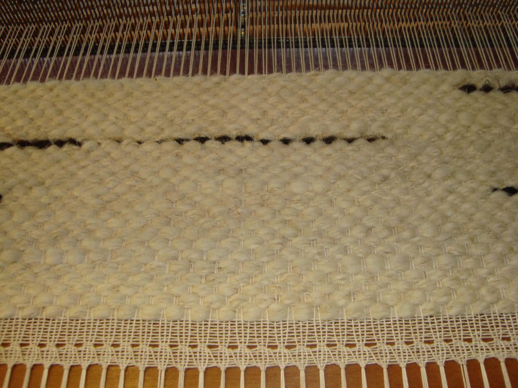 Détail d'un tapis en laine filée main